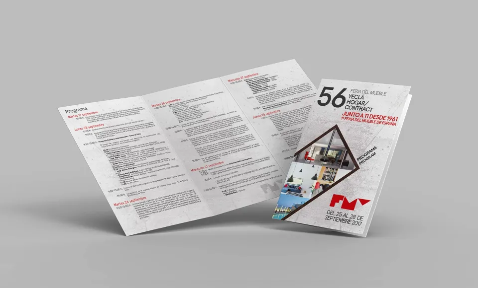 Trifold programme brochure for the Yecla Furniture Fair unfolded next to the poster