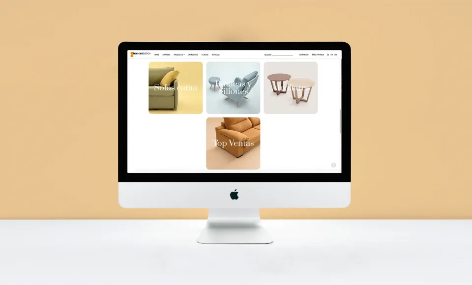 Web de Francés Bañón en un iMac con la rejilla de productos destacados sobre fondo naranja