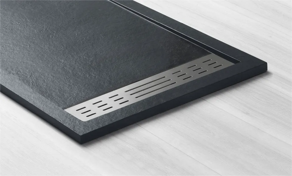 3D render for Habitacua of a black slate-effect shower tray with a linear drain grille