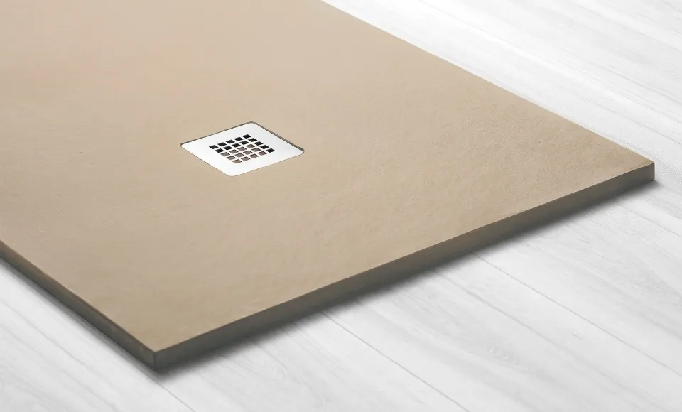 3D render for Habitacua of a beige shower tray with a square drain cover