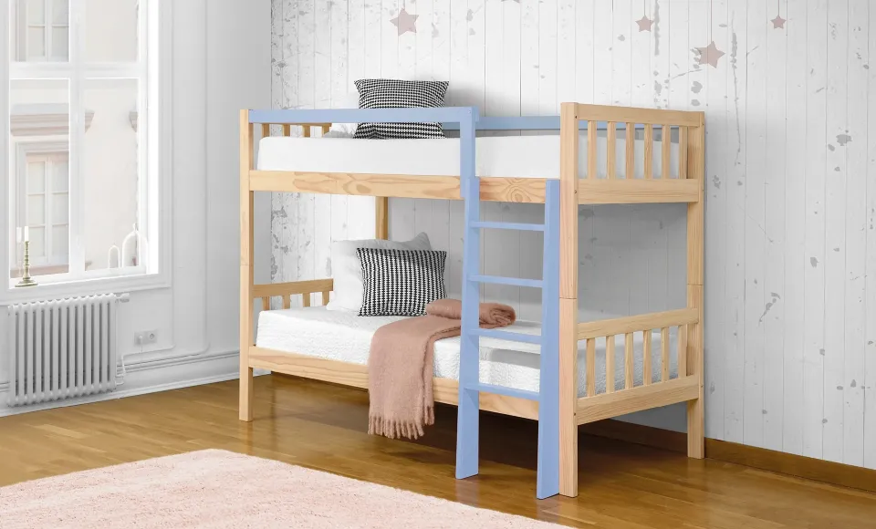 Wooden bunk bed with a blue ladder and star-print bedding