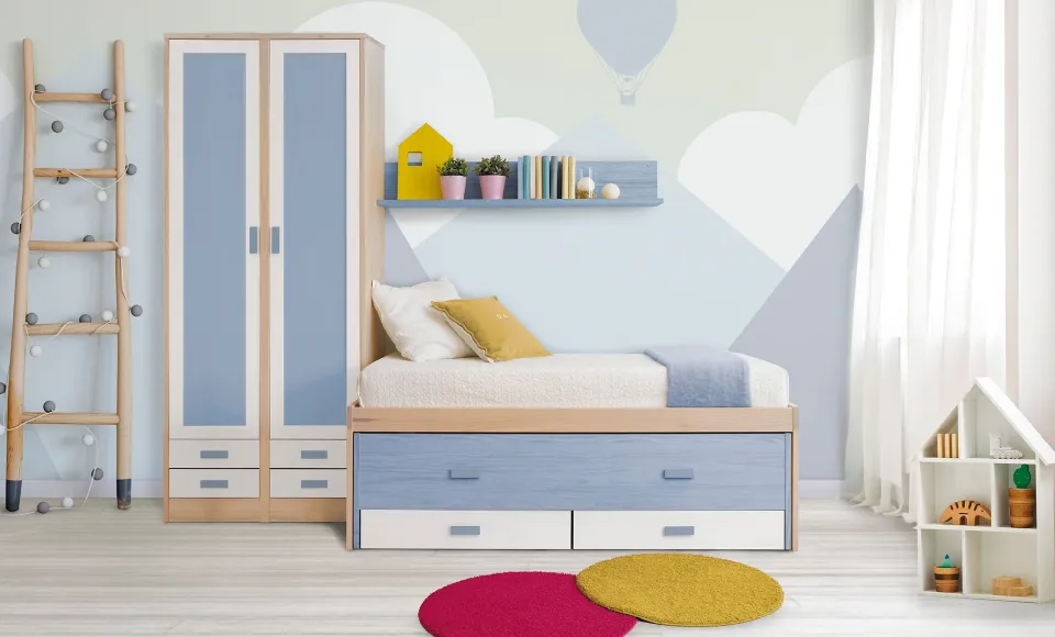 Blue-and-wood children's bedroom with a trundle bed, wardrobe and a toy house