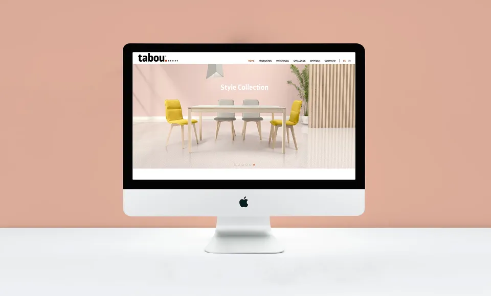 Ordenador con la web de Tabou Design mostrando la Style Collection en sillas amarillas
