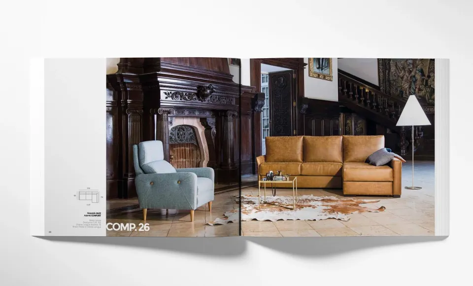 Doble página del catálogo Tayber con un sillón azul y un sofá de piel en una sala señorial